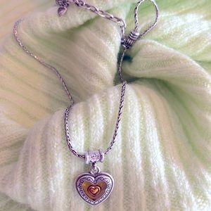 Retired free floating gold heart pendant necklace. New condition without tags.